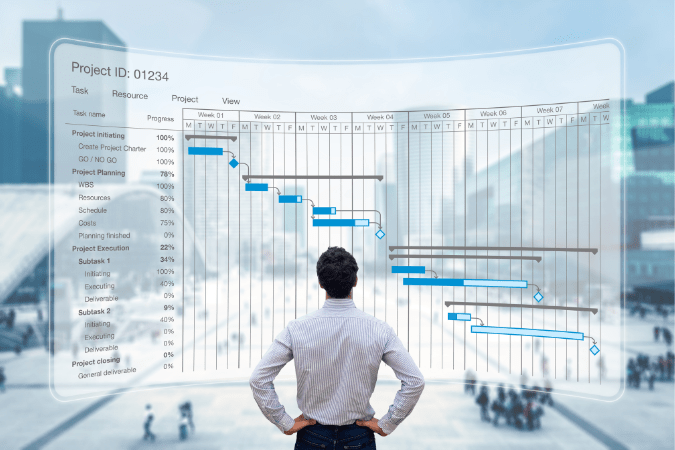 Man standing in front of screen with a schedule