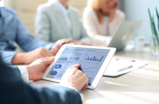 man using ipad for financial report 