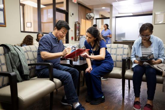 people in the waiting area of a medical facility