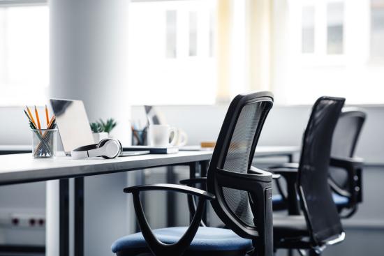 Close up of office chairs and desk