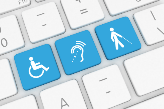 Keys on a computer keyboard with three accessible symbols in blue: handicap, hearing impaired, and visually impaired. 