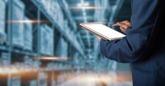 man taking inventory in a warehouse 